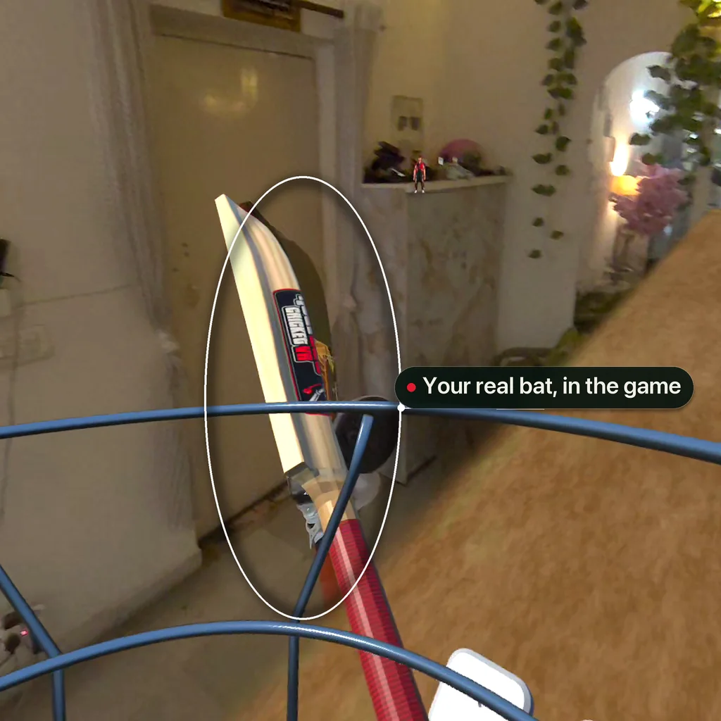 In the game, the calibrated virtual bat in the player's hands at the crease, highlighted