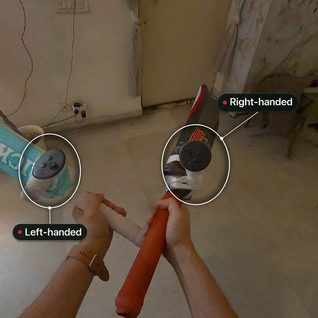 Two cricket bats with a Meta Quest controller taped to each, seen through the headset: a light blue bat set up for a left-handed batter and an orange-handled bat set up for a right-handed batter, the two mounts mirror images of each other